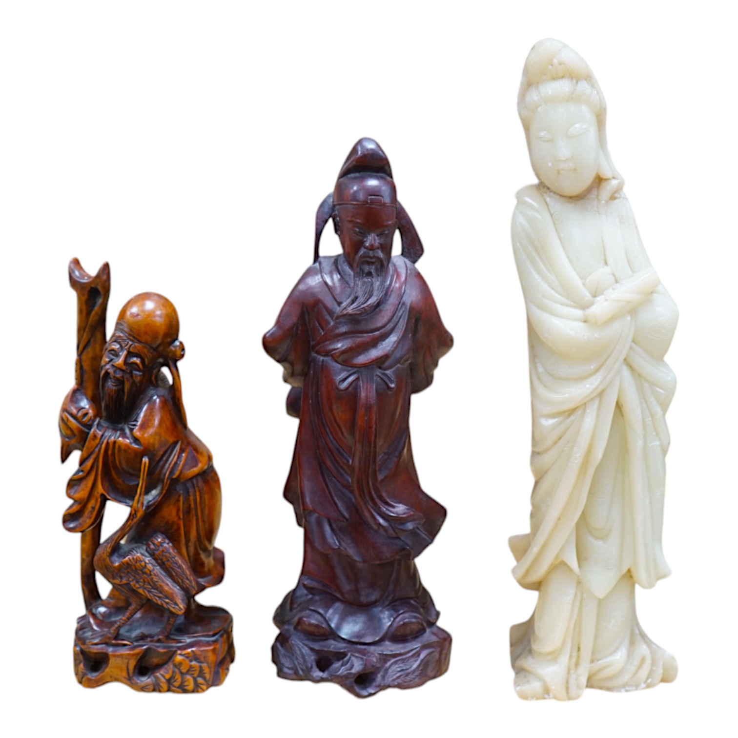 Two Chinese hardwood carved figures and a soapstone figure of Guanyin, largest 37cm high. Condition - fair